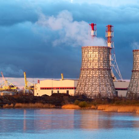 Energy power plant in front of dark clouds. 